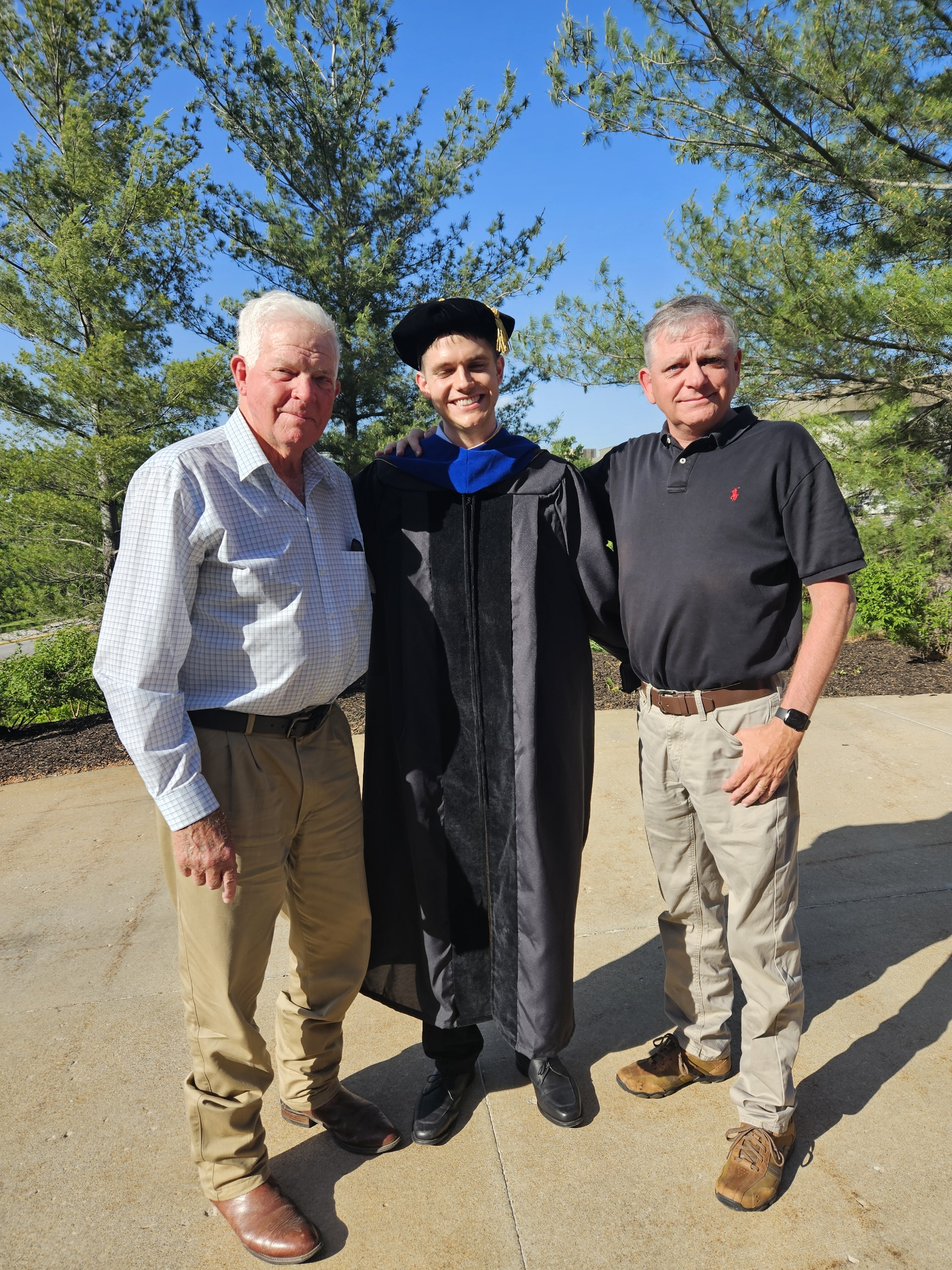 Graduation picture with my grandpa and dad